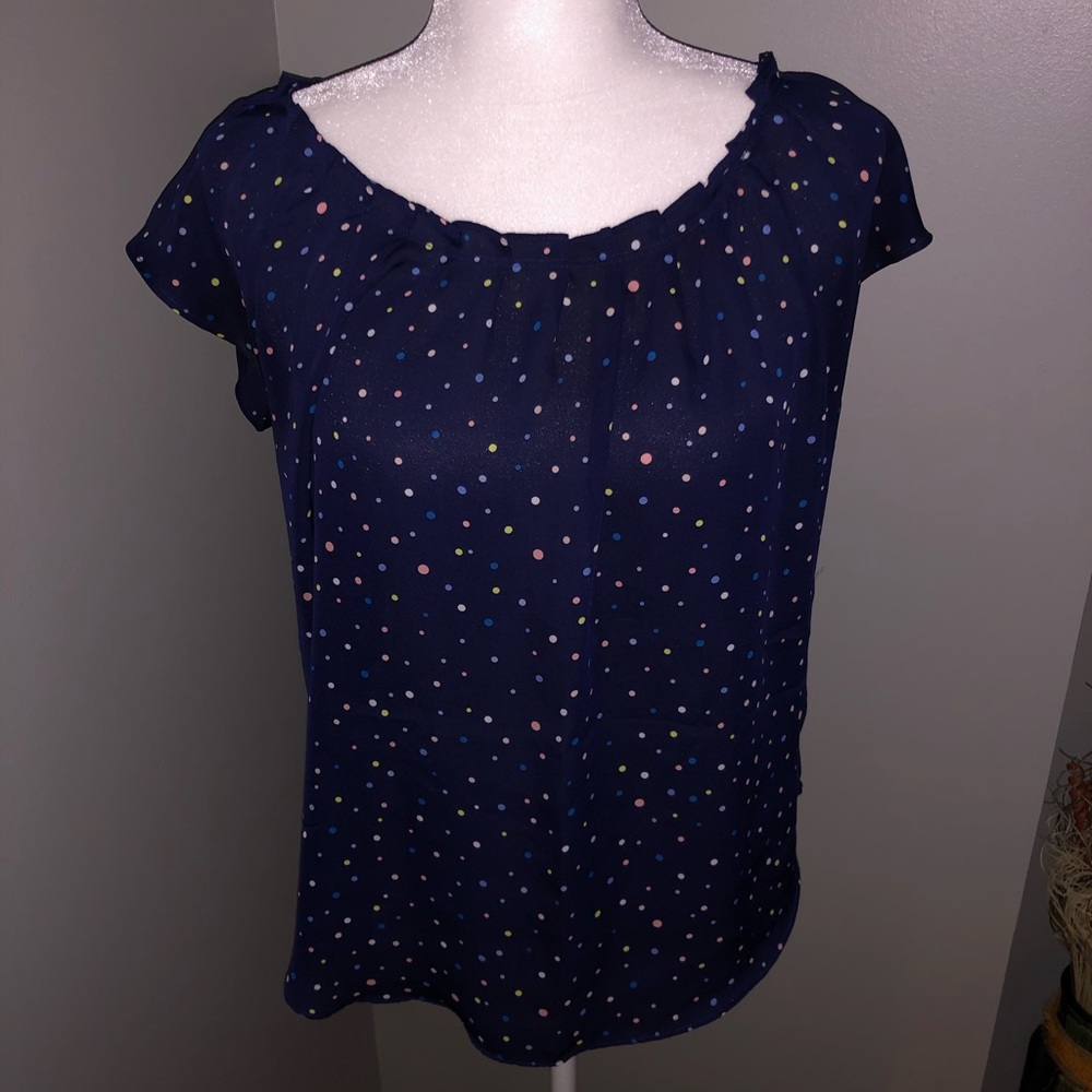 Blue colored polka dot blouse
